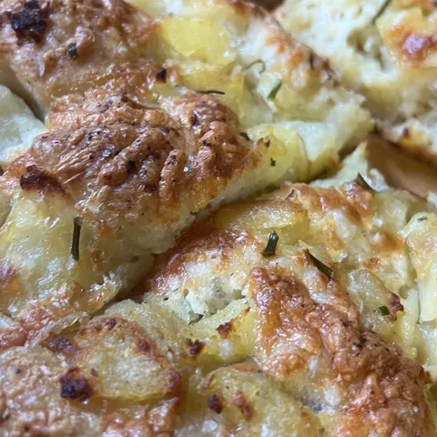 Potato and cheddar focaccia, torn into pieces.