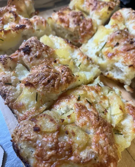 Potato and cheddar focaccia, torn into pieces.