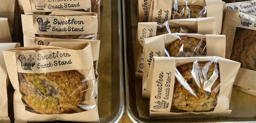 Wrapped Sweetfern cookies and bars in stamped paper bags.