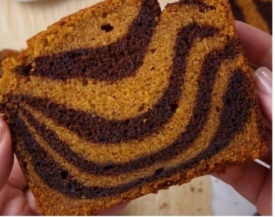A slice of pumpkin chocolate swirl loaf.